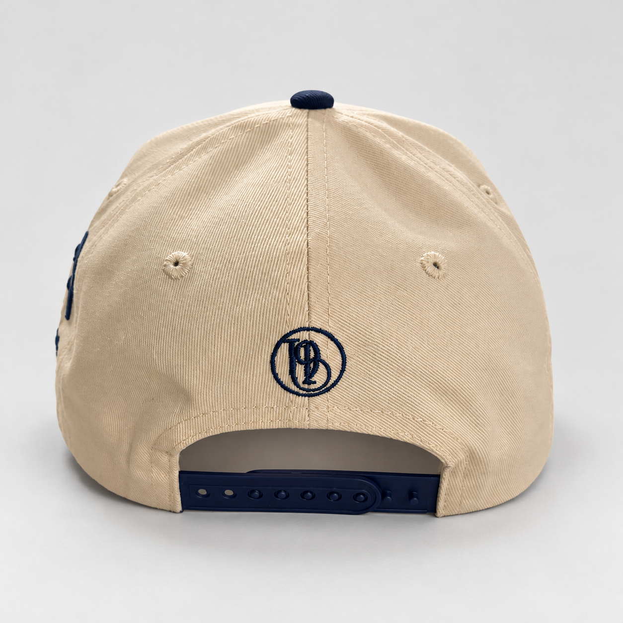 JEHOVAH RAPHA Puff Embroidered Snapback Cap | Navy Blue / Cream