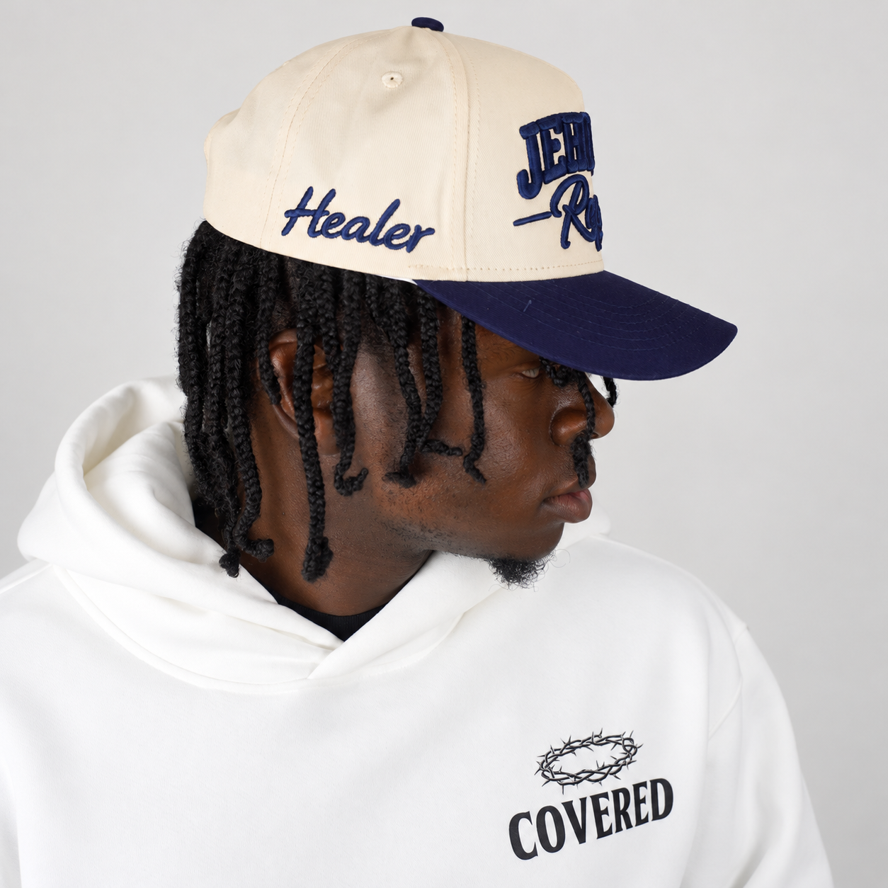 JEHOVAH RAPHA Puff Embroidered Snapback Cap | Navy Blue / Cream