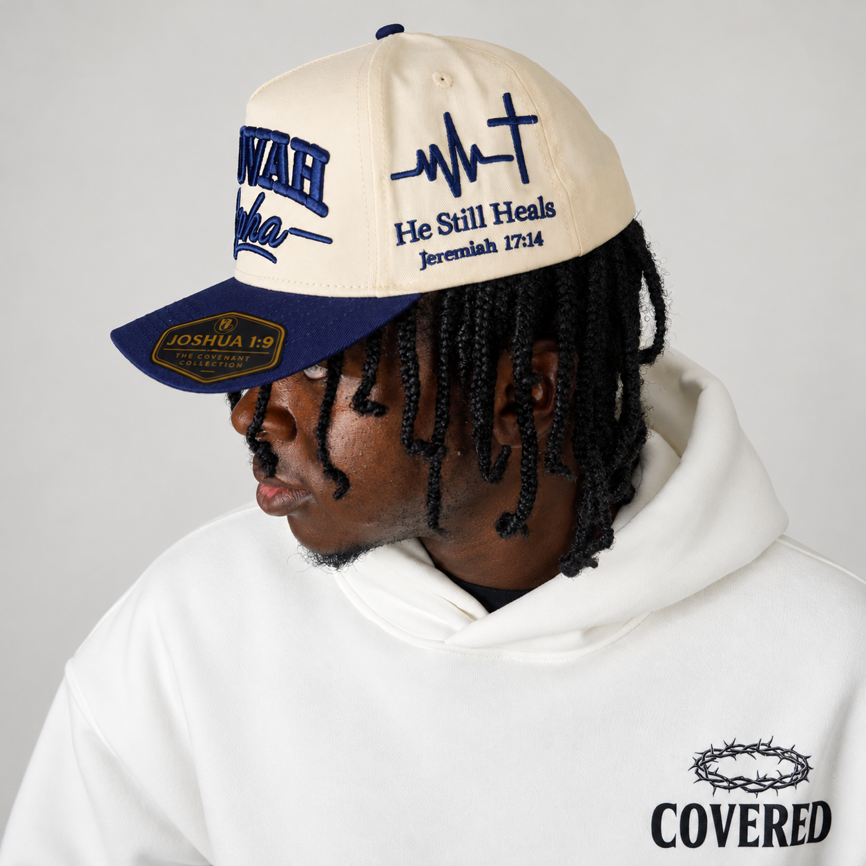 JEHOVAH RAPHA Puff Embroidered Snapback Cap | Navy Blue / Cream